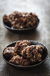 Bowls of choco crossies on table, close up - EVG000088