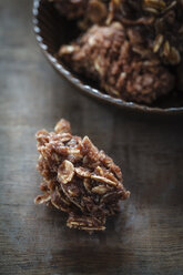 Bowl of choco crossies on table, close up - EVG000089