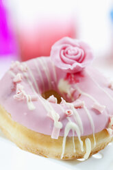 Doughnut topped with pink icing, close up - CSF017893