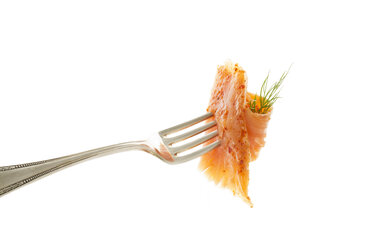 Smoked salmon on fork against white background, close up - MAEF006211