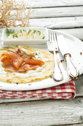 Plate of pancake with smoked salmon, horseradish and dill, close up - MAEF006225