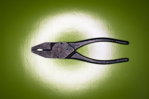 Old pliers on wooden background, close up - KJF000211