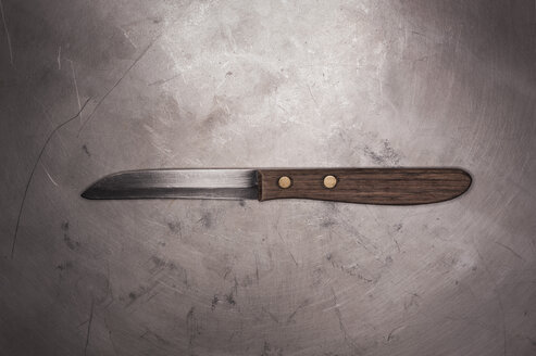 Old kitchen knife on metal surface - KJF000213