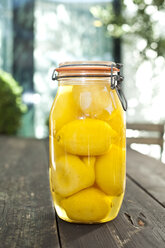 Germany, Duesseldorf, Lemon pickles in glass of jar - KVF000012