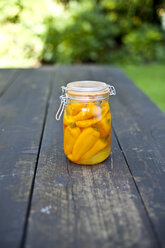 Germany, Duesseldorf, Yellow paprikas pickle in glass of jar - KVF000016