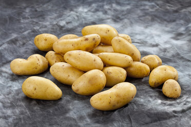 Potatoes on grey background, close up - CSF018185