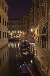 Italy, Venice, Gondalas on little canal near St Mark's Square at night - HSIF000262