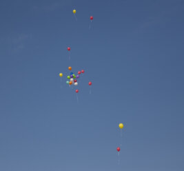Germany, Bavaria, Variety of balloons flying in sky - HSIF000288