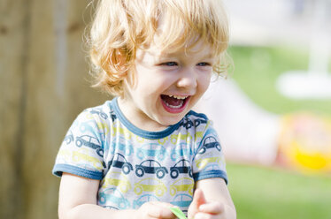 Austria, Boy laughing and looking away, close up - LF000513