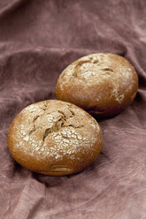 Rye rolls on textile, close up - CSF018291