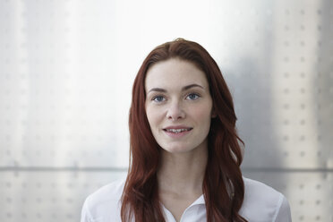 Germany, Cologne, Portrait of young woman, smiling - RHYF000298