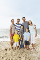 Spain, Portrait of family on beach at Palma de Mallorca, smiling - SKF001188