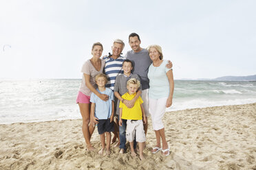 Spain, Portrait of family on beach at Palma de Mallorca, smiling - SKF001189