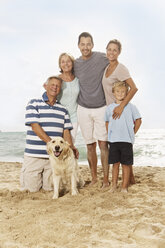 Spain, Portrait of family on beach at Palma de Mallorca, smiling - SKF001235