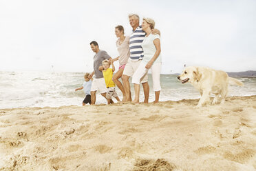 Spain, Family walking on beach at Palma de Mallorca - SKF001237