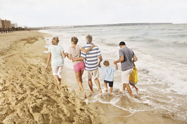 Spain, Family walking on beach at Palma de Mallorca - SKF001207