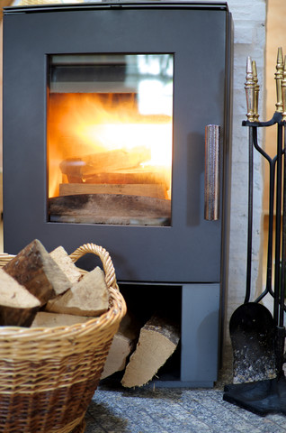 Fireplace with wood burning stock photo