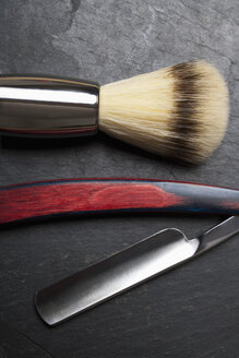 Shaving brush and razor on slate board, close up - TDF000040