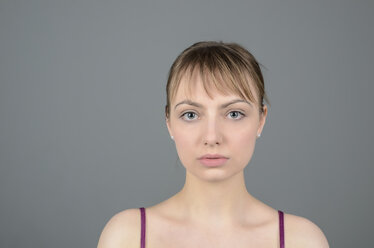 Portrait of young woman serious, close up - ONF000116