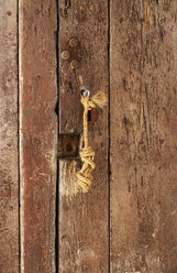 Spain, Door of old town with key, close up - WWF002823