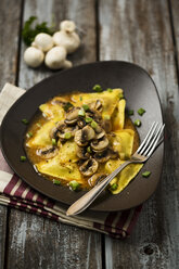 Ravioli with mushrooms on plate - MAEF006387