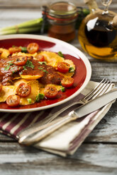 Ravioli with tomato sauce on plate - MAEF006408