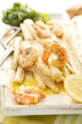 King prawns with white asparagus and basil on plate, close up - MAEF006445