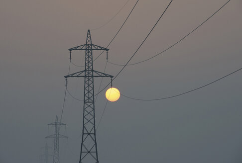 Austria, View of electric pylon at sunrise - CWF000035