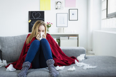 Germany, Bavaria, Munich, Young woman suffering from cold - SPOF000353