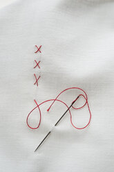 Embroidery cross on fabric with red thread - CRF002389