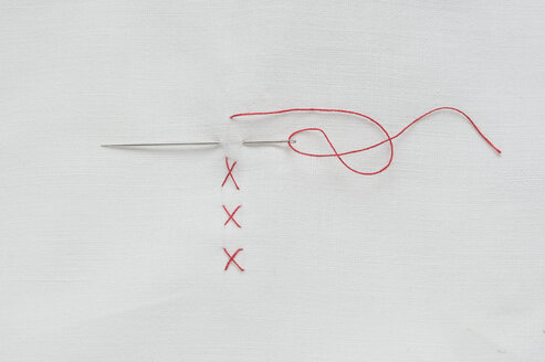 Embroidery cross on fabric with red thread - CRF002390