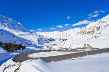 Switzerland, View of mountain road covered in snow - WDF001709