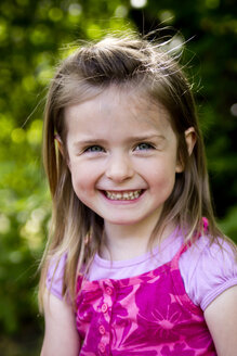 Germany, Bavaria, Portrait of girl smiling, close up - SARF000010