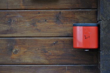 Germany, Bavaria, Red ashtray on wooden wall, - AXF000436