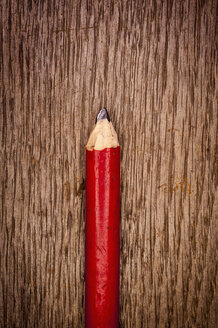 Old carpenter pencil on wooden background, close up - KJF000221