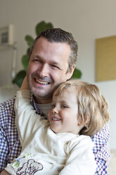 Germany, Father and daughter having fun, close up - JFEF000086