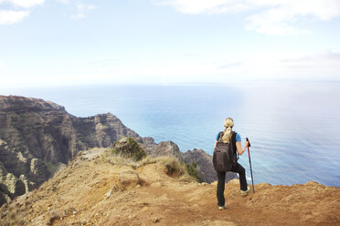 USA, Hawaii, Mid adult woman standing on top of mountain - SKF001285