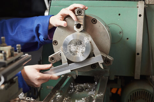 Germany, Kaufbeuren, Woman working in manufacturing industry - DSC000076