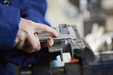 Germany, Kaufbeuren, Woman working in manufacturing industry - DSC000073