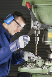 Germany, Kaufbeuren, Man working in manufacturing industry - CA000005