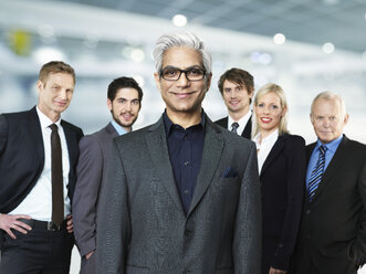 Portrait of businessmen and woman, smiling - STKF000257