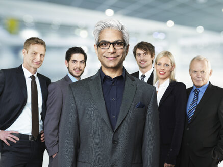 Portrait of businessmen and woman, smiling - STKF000257