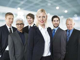 Portrait of businessmen and woman, smiling - STKF000256
