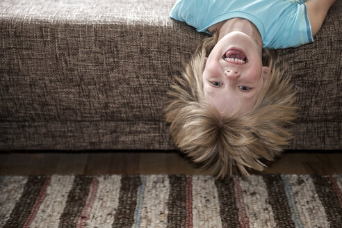 Austria, Boy lying on couch - CWF000050