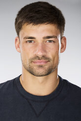 Portrait of young man against white background, close up - MAEF006675