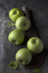 Green apples with sickle, close up - CSF019344