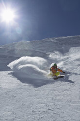 Austria, Tyrol, Mature man skiing in slope - FF001354