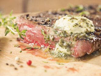 Rump steak with herb butter on wood - CH000034