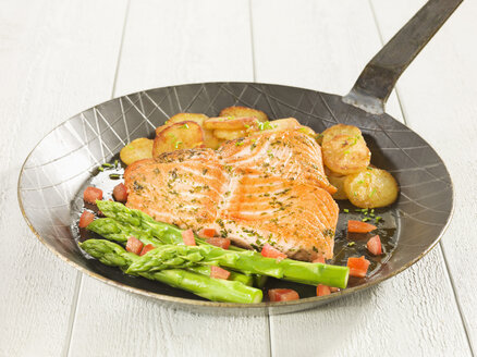 Marinated salmon with vegetables on frying pan - CHF000043