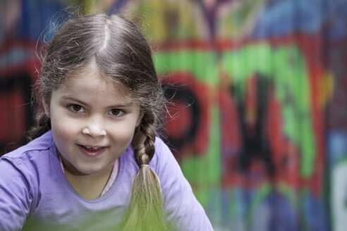 Germany, North Rhine Westphalia, Cologne, Portrait of girl, smiling - FMKYF000447